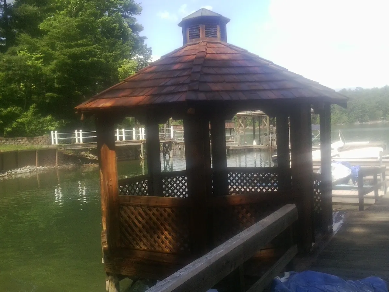 Cedar shake gazebo roof rebuilt on a lake dock in Center Point